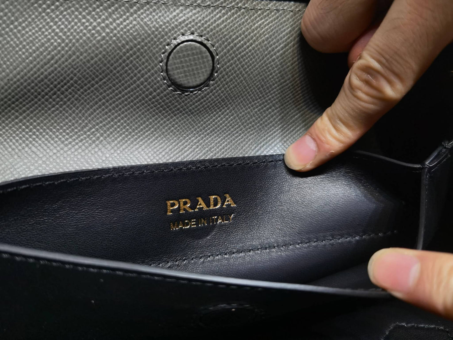 pra 1bg775 handbag double saffiano 33cm grey lambskin equipped with double handles detachable shoulder straps and soft sheepskin lining paired with gold accents