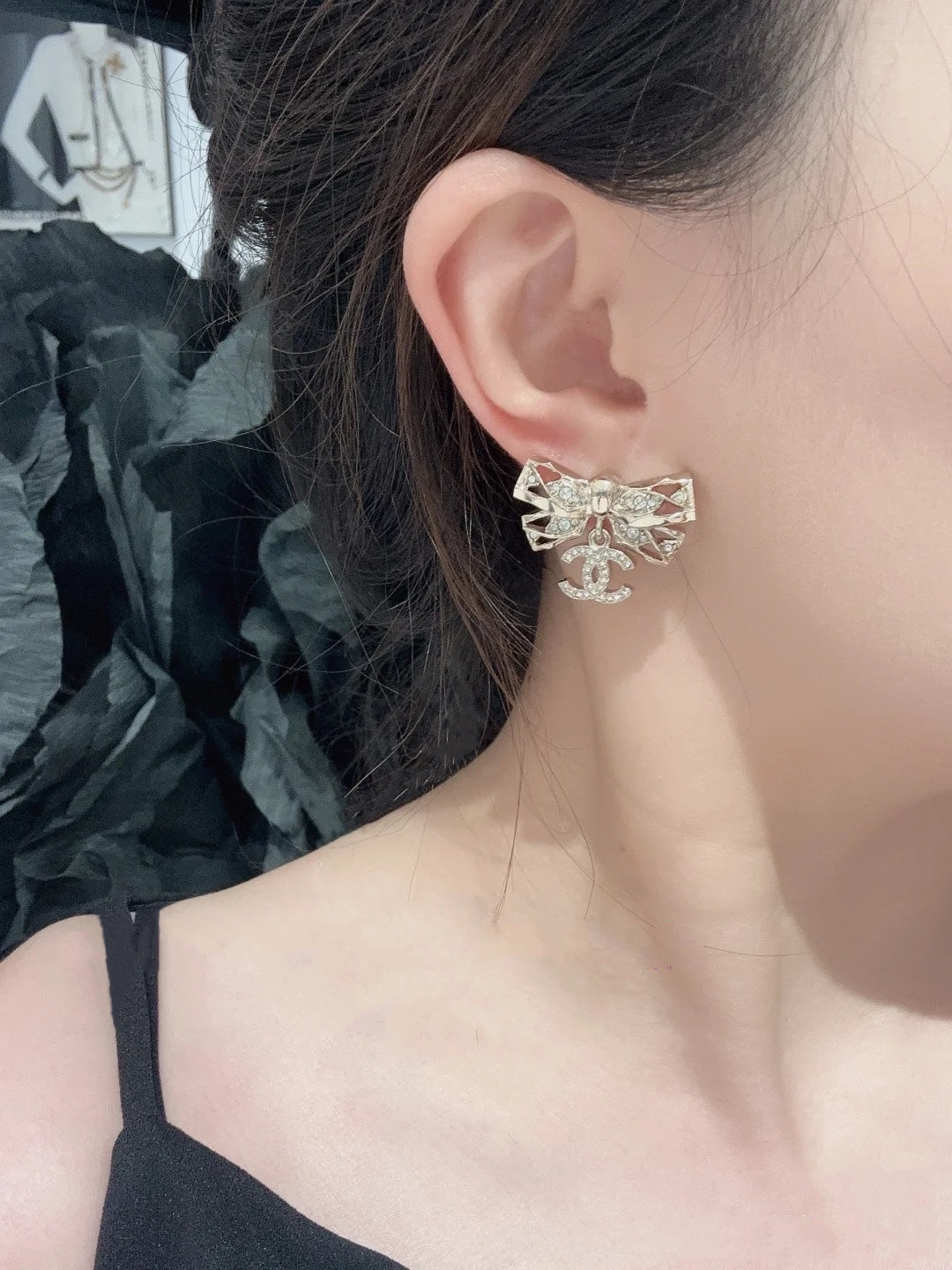 24 hollow diamond studded butterfly bow double c earrings eha210