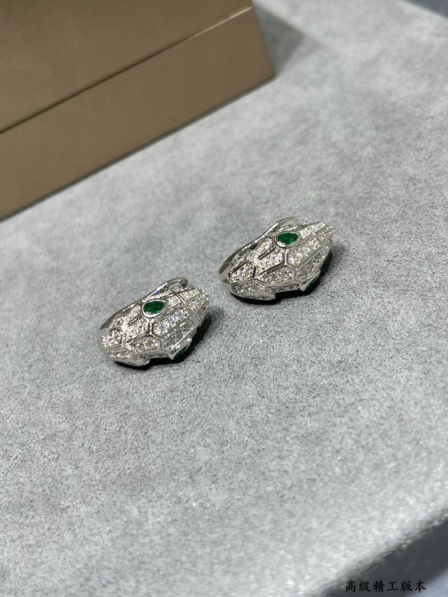 bv diamond studded green eyed snake silver earrings eha291