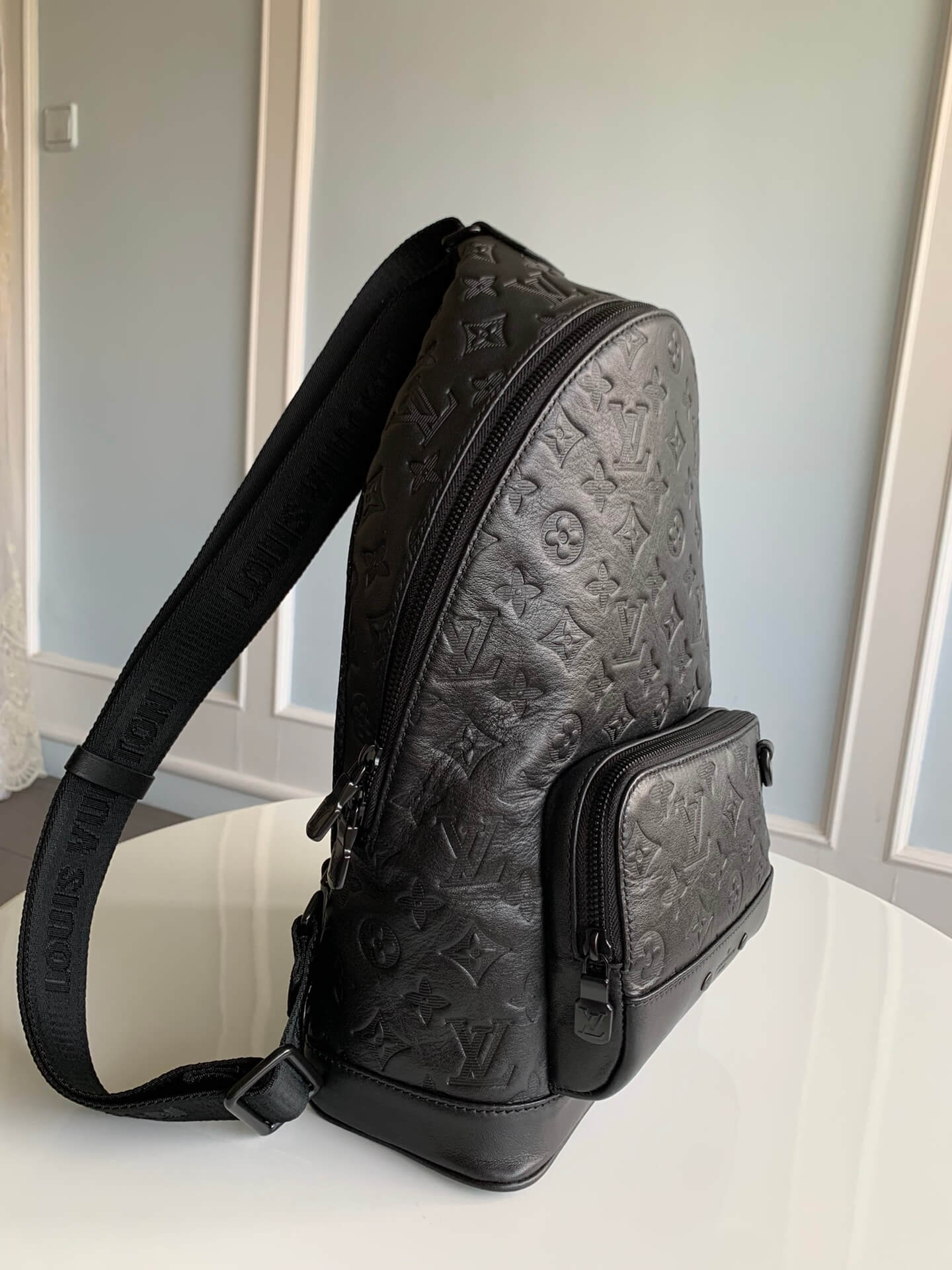 m46107 racer monogram shadow chest bag black calfskin