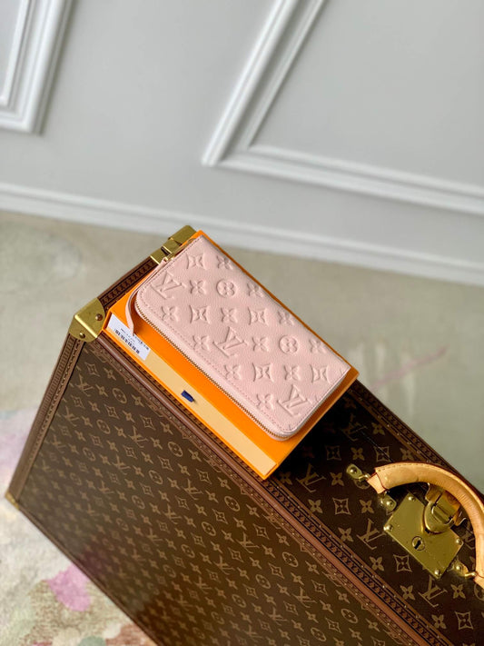 M82926 ZIPPY WALLET Spring in the City Monogram Empreinte wallet sakura pink