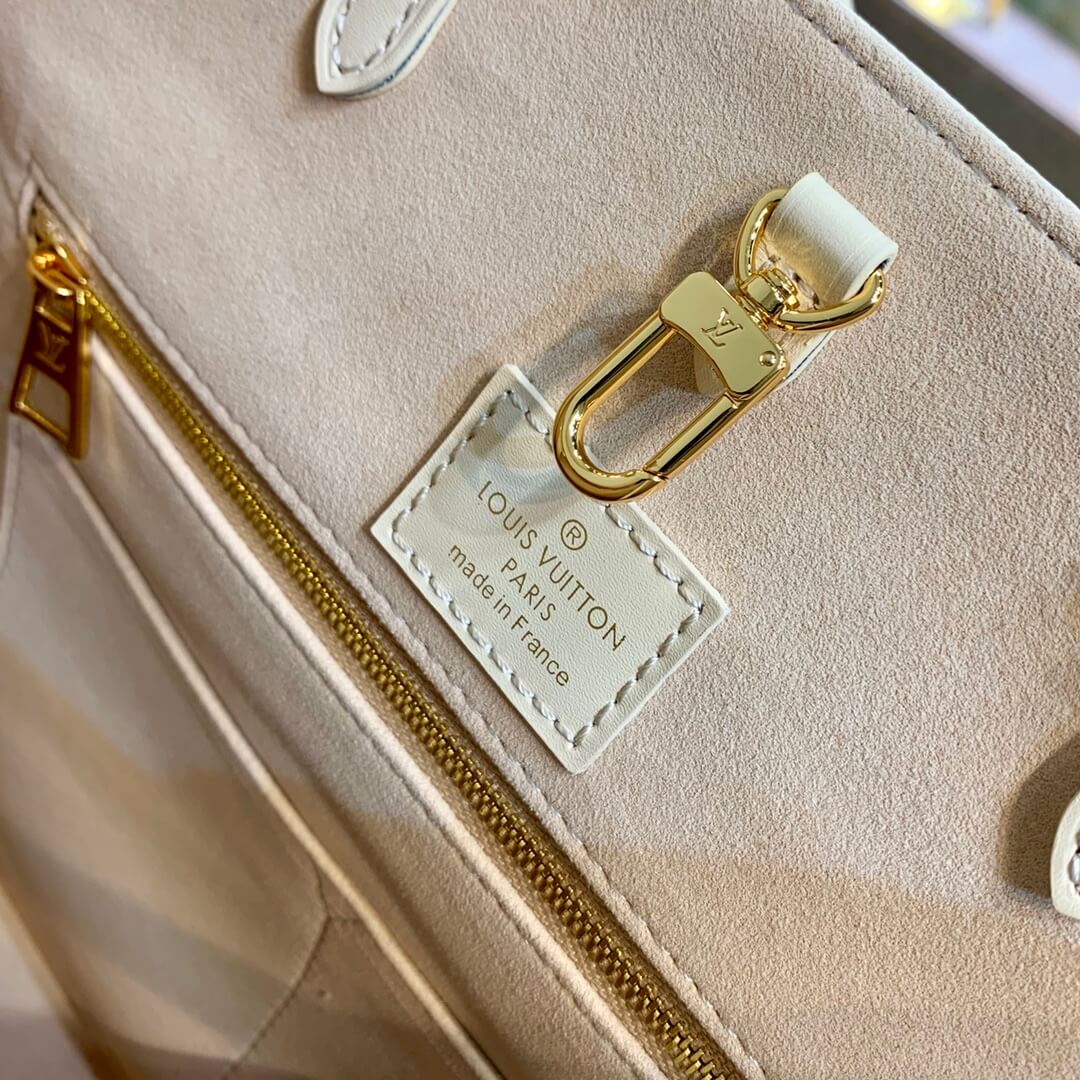 m21575 onthego mm monogram empreinte leather apricot 35cm