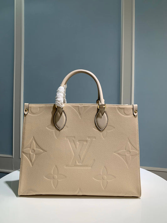 m45595 onthego mm monogram empreinte leather white 35cm handbag