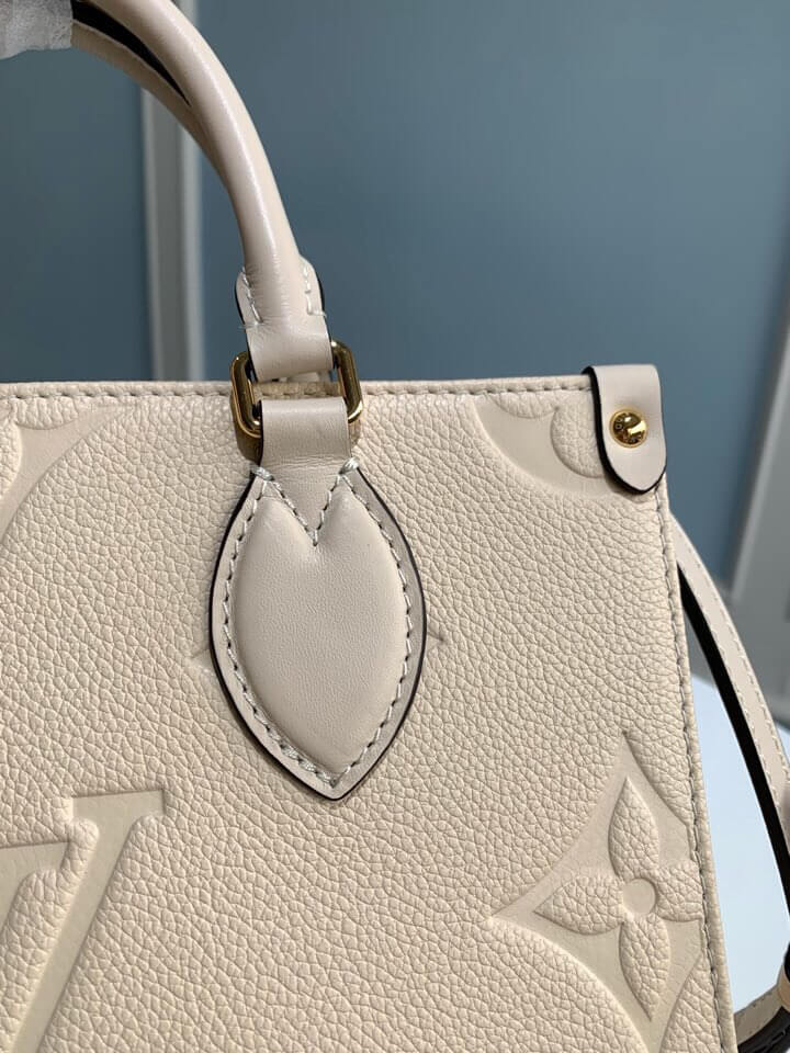 m45653 onthego pm monogram empreinte leather white 25cm