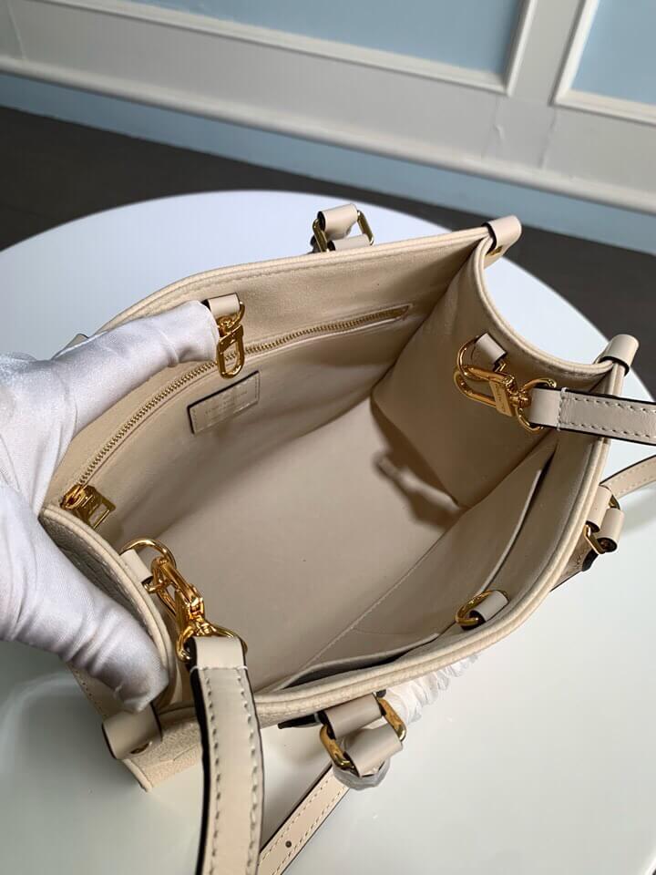 m45653 onthego pm monogram empreinte leather white 25cm