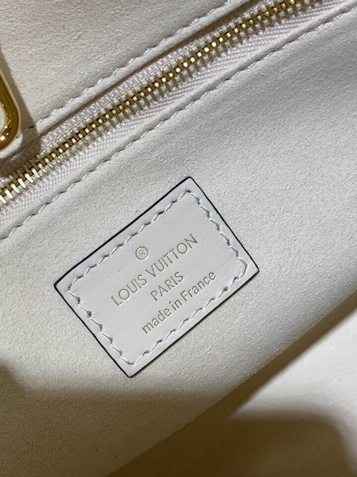 m45653 onthego pm monogram empreinte leather white 25cm