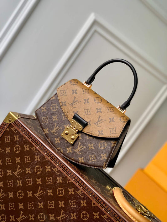 m46548 tilsitt handbag 23 5cm monogram and monogram reverse coated canvas