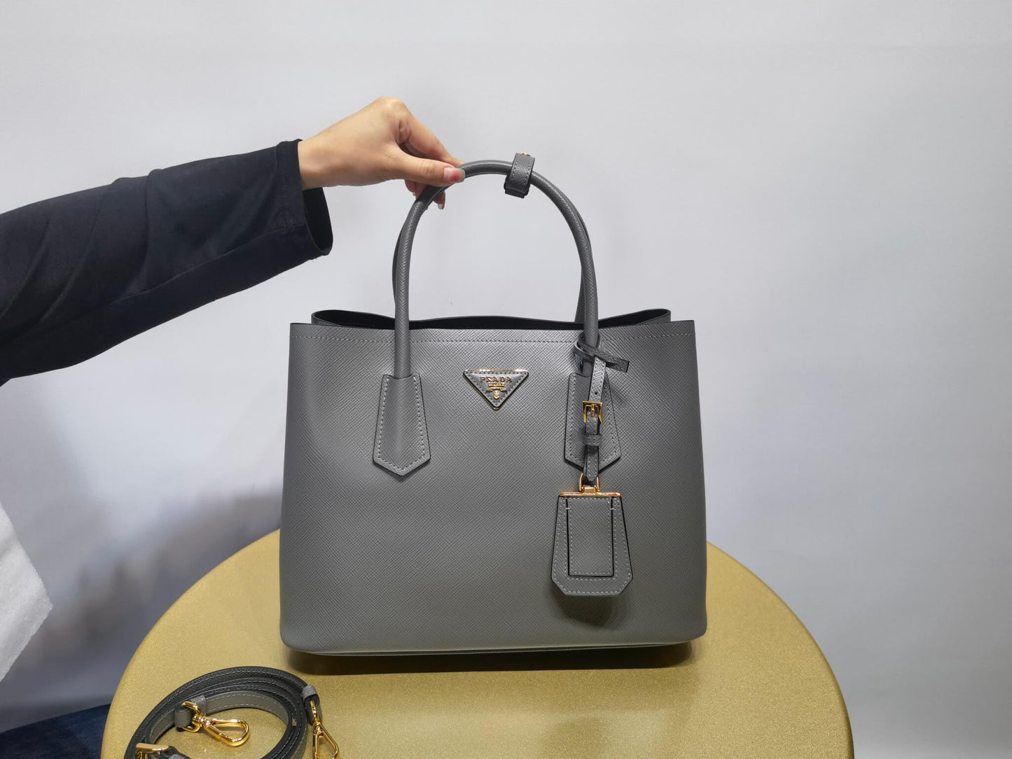 pra 1bg775 handbag double saffiano 33cm grey lambskin equipped with double handles detachable shoulder straps and soft sheepskin lining paired with gold accents
