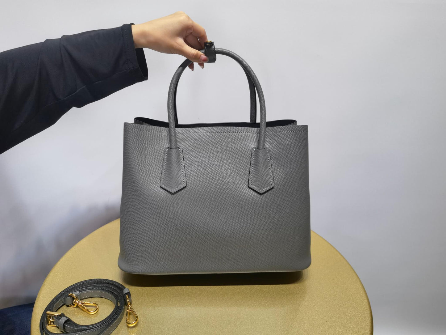 pra 1bg775 handbag double saffiano 33cm grey lambskin equipped with double handles detachable shoulder straps and soft sheepskin lining paired with gold accents