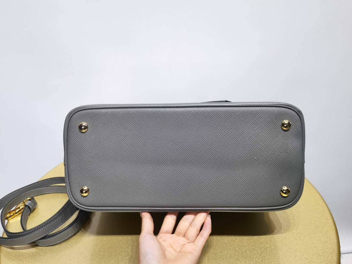 pra 1bg775 handbag double saffiano 33cm grey lambskin equipped with double handles detachable shoulder straps and soft sheepskin lining paired with gold accents