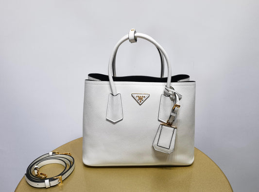 pra 1bg775 handbag double saffiano 33cm milk white lambskin equipped with double handles detachable shoulder straps and soft sheepskin lining paired with gold accents