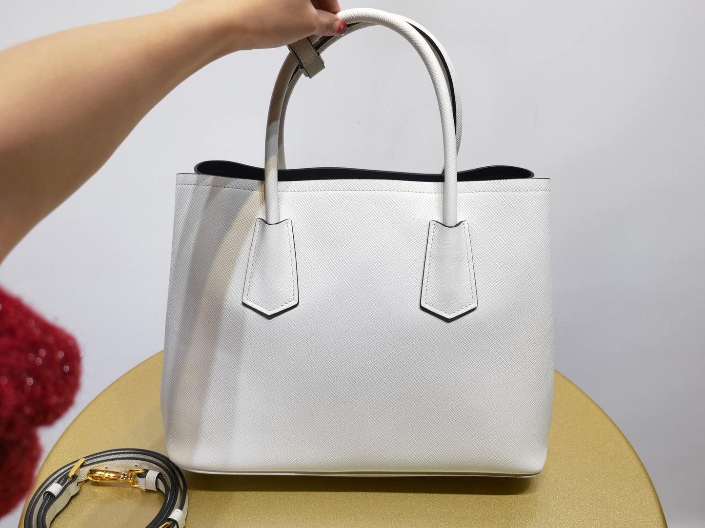 pra 1bg775 handbag double saffiano 33cm milk white lambskin equipped with double handles detachable shoulder straps and soft sheepskin lining paired with gold accents