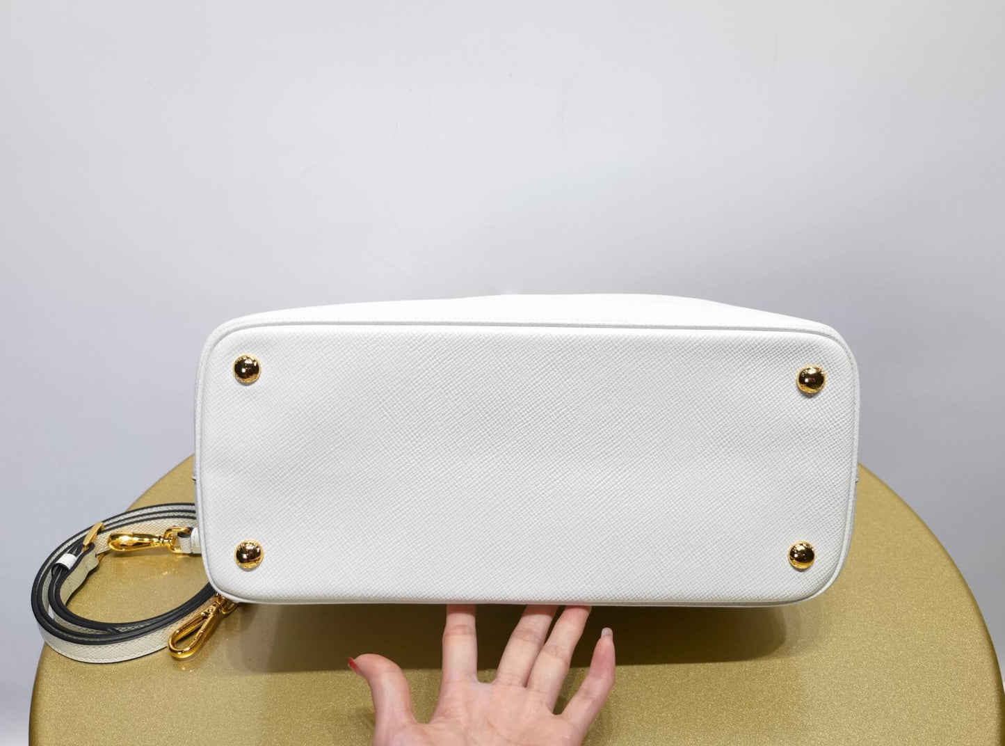 pra 1bg775 handbag double saffiano 33cm milk white lambskin equipped with double handles detachable shoulder straps and soft sheepskin lining paired with gold accents