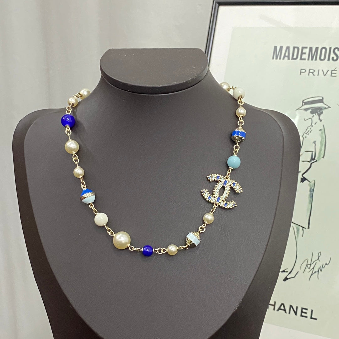 Chanel's New Trendy Blue Glass Pearl Double C Gold Necklace XLA83