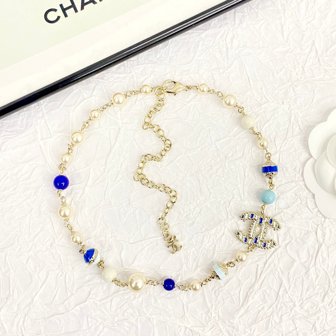 Chanel's New Trendy Blue Glass Pearl Double C Gold Necklace XLA83