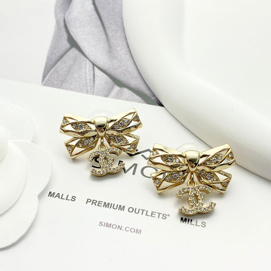 24 hollow diamond studded butterfly bow double c earrings EHA210