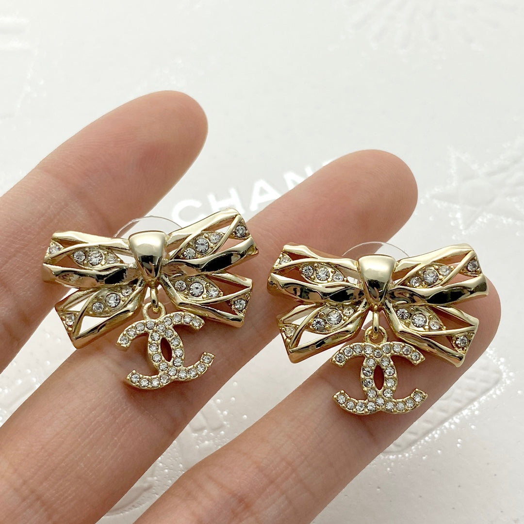 24 hollow diamond studded butterfly bow double c earrings EHA210