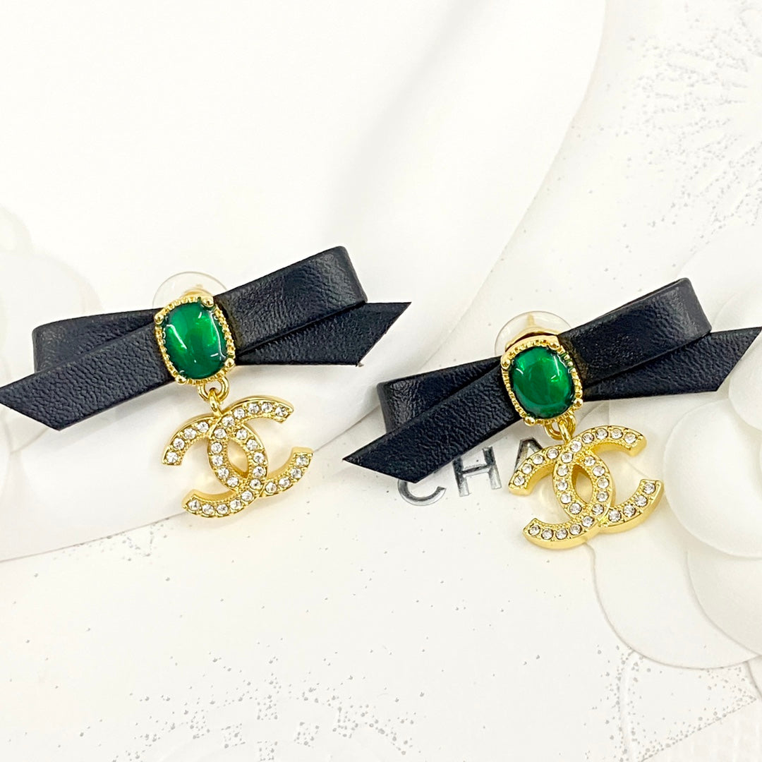 Black skin bow pearl studded diamond double earrings EHA335