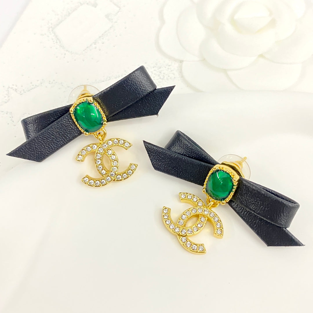 Black skin bow pearl studded diamond double earrings EHA335