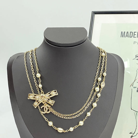 24 hollow bow triple chain pearl necklace XLA268