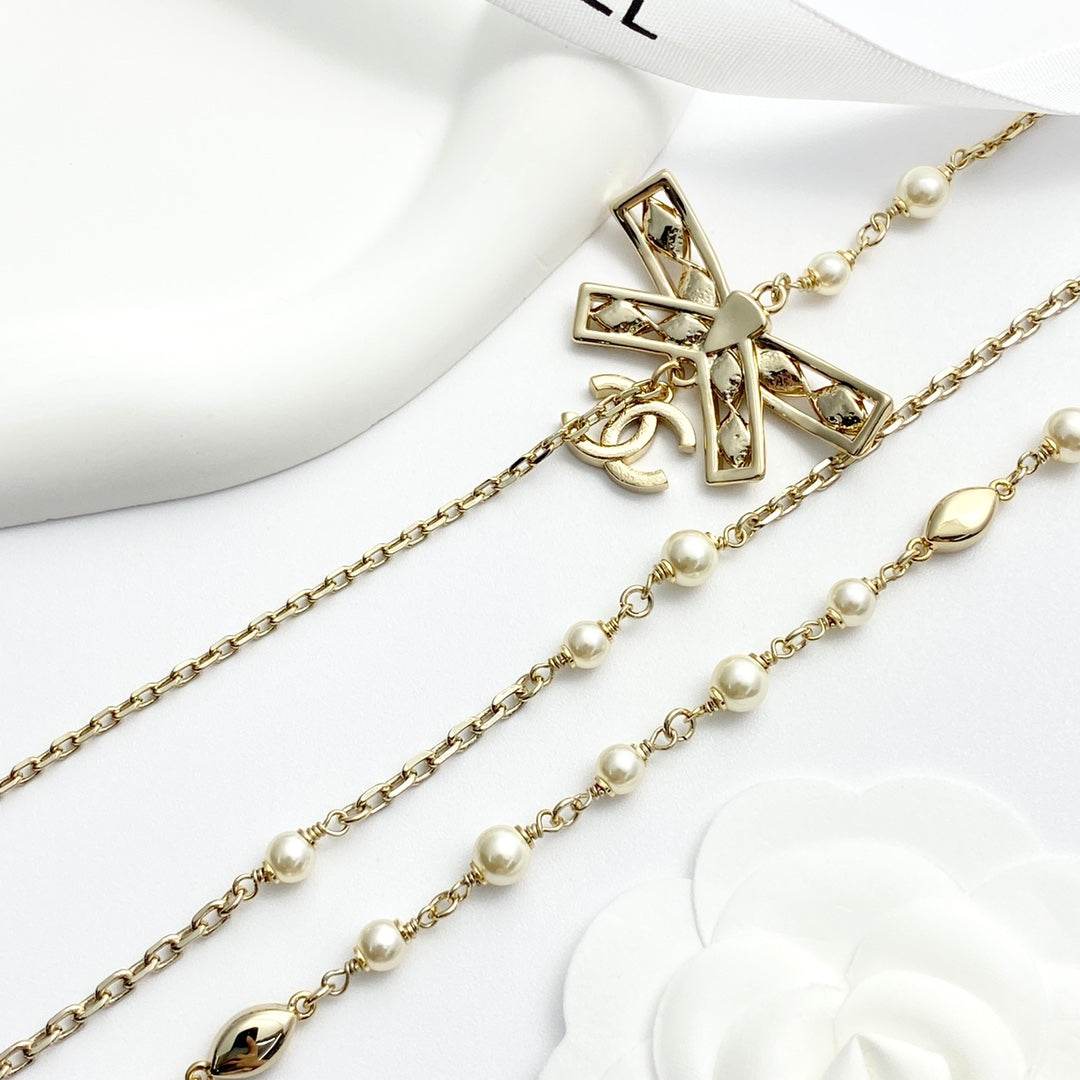 24 hollow bow triple chain pearl necklace XLA268