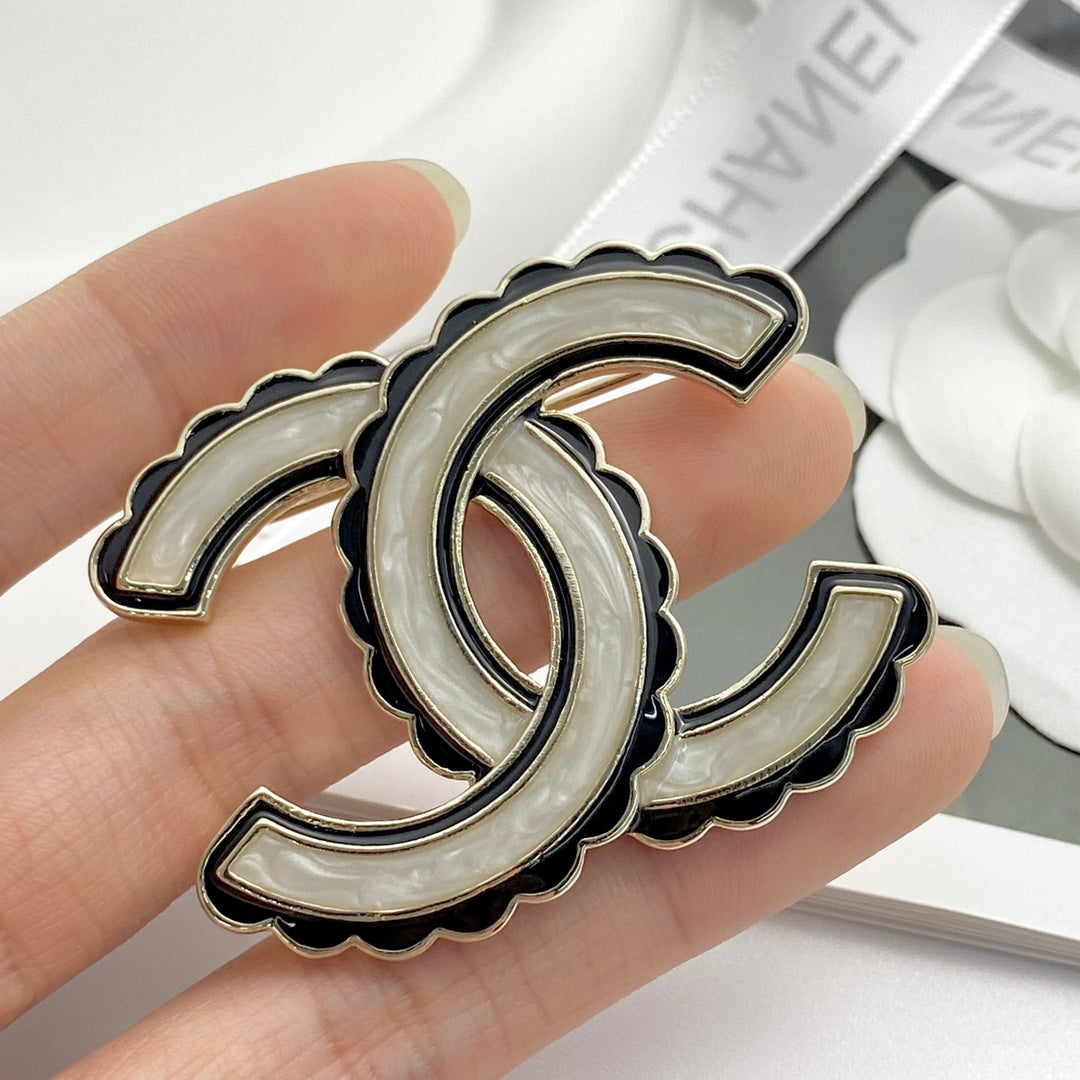 24 black enamel lace double c brooch xza13