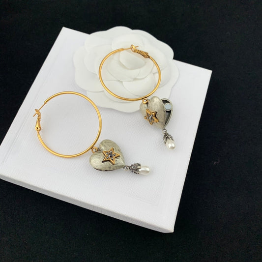 mcqueen heart shaped yellow gold earrings eha670
