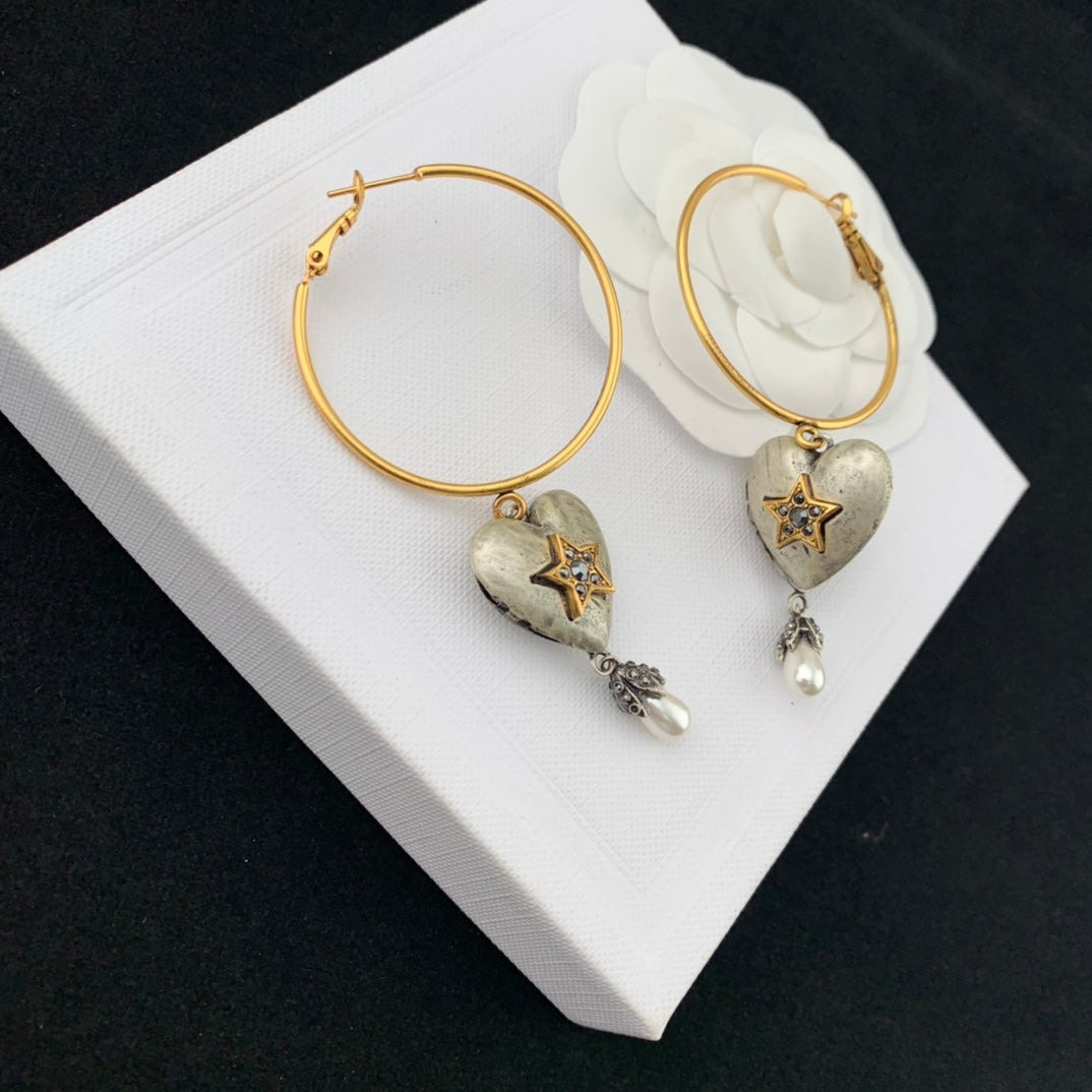 mcqueen heart shaped yellow gold earrings eha670