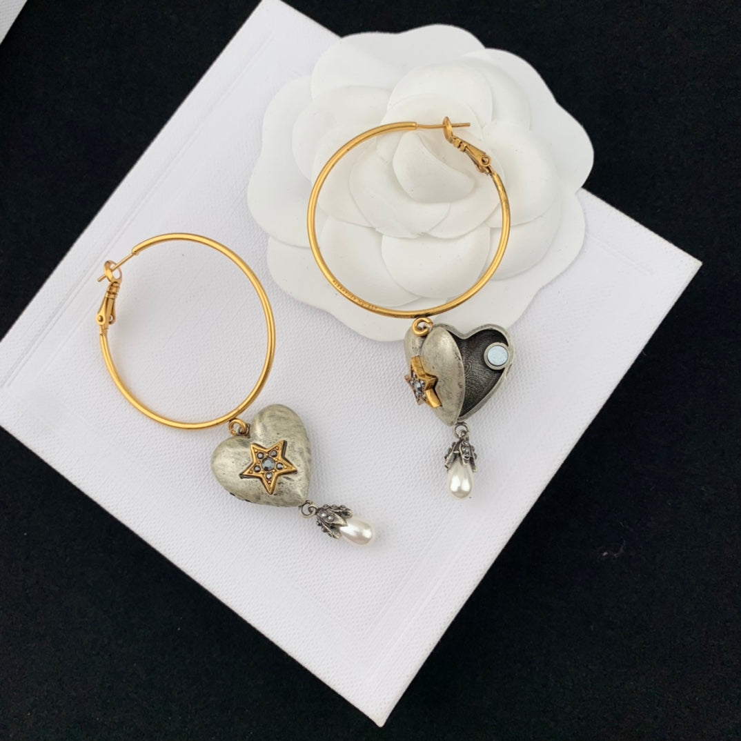 mcqueen heart shaped yellow gold earrings eha670