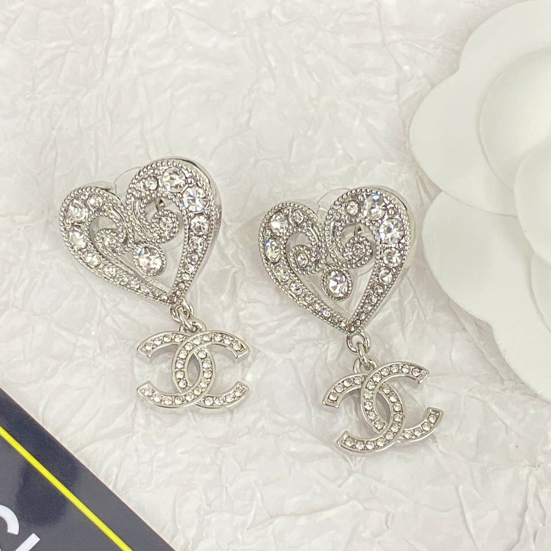 Platinum hollow crystal heart-shaped earrings EHA394