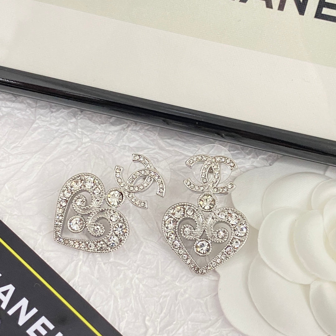 hollow crystal heart shaped double c silver earrings eha536