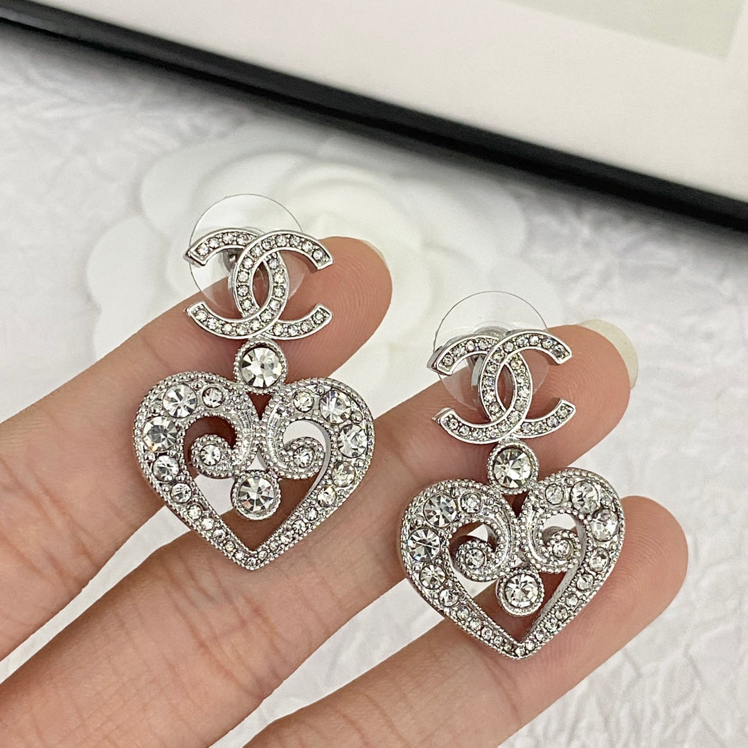 hollow crystal heart shaped double c silver earrings eha536