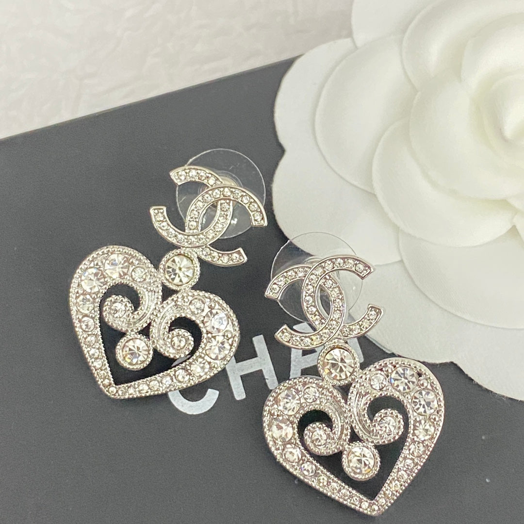 hollow crystal heart shaped double c silver earrings eha536