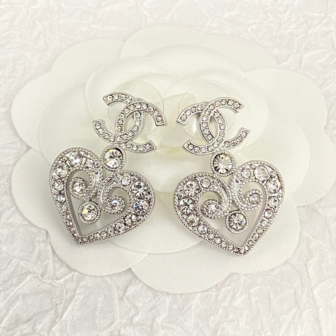 hollow crystal heart shaped double c silver earrings eha536