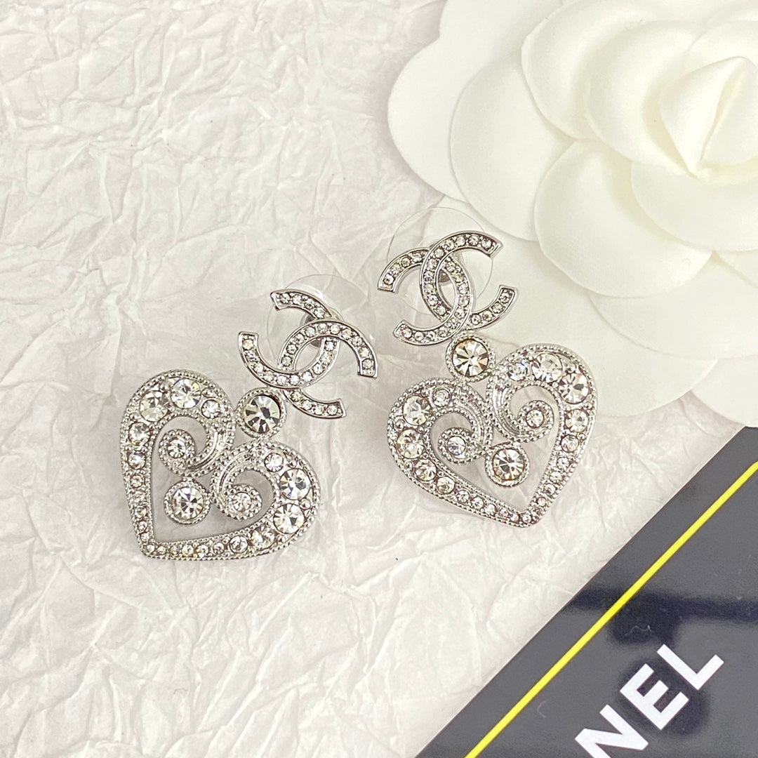 hollow crystal heart shaped double c silver earrings eha536