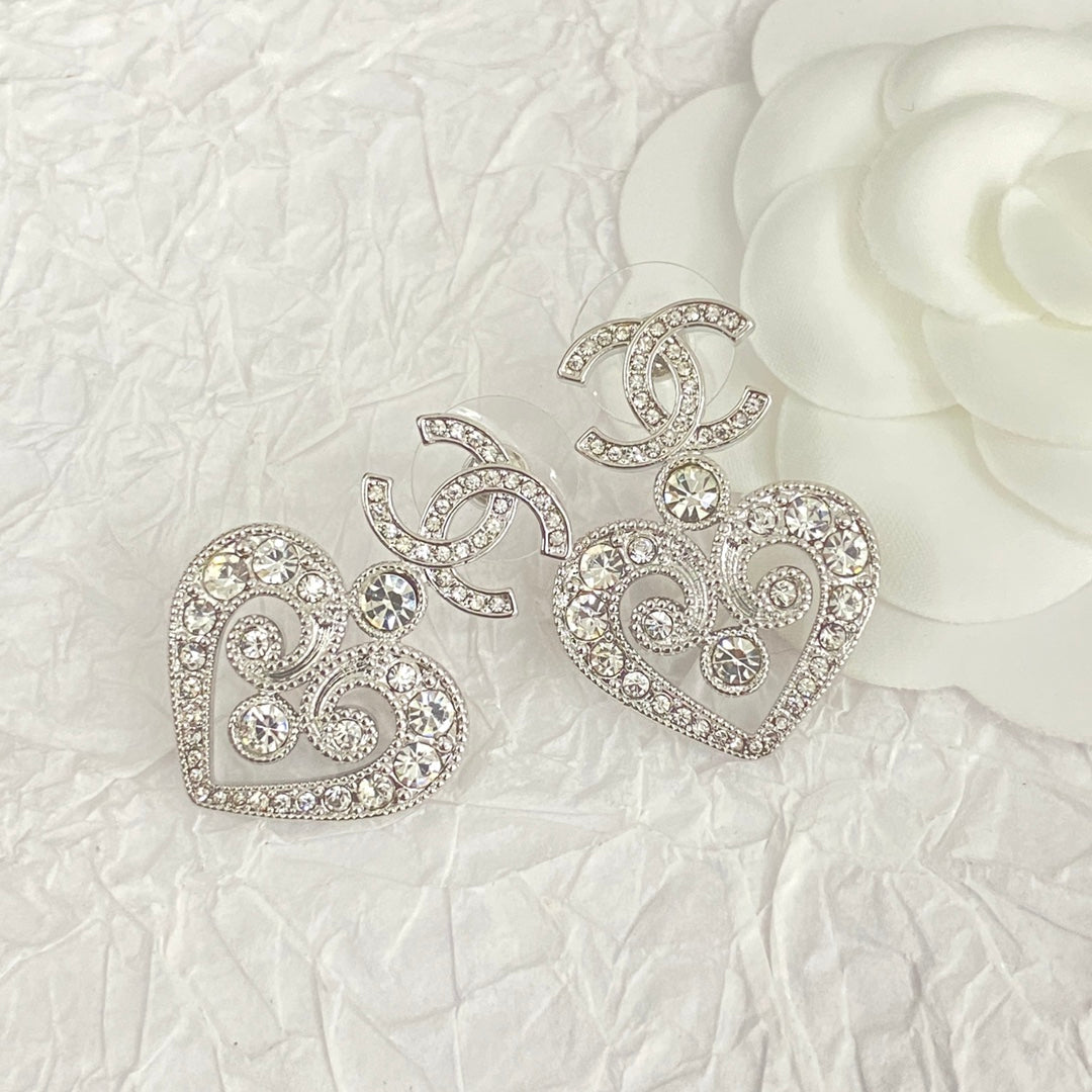hollow crystal heart shaped double c silver earrings eha536