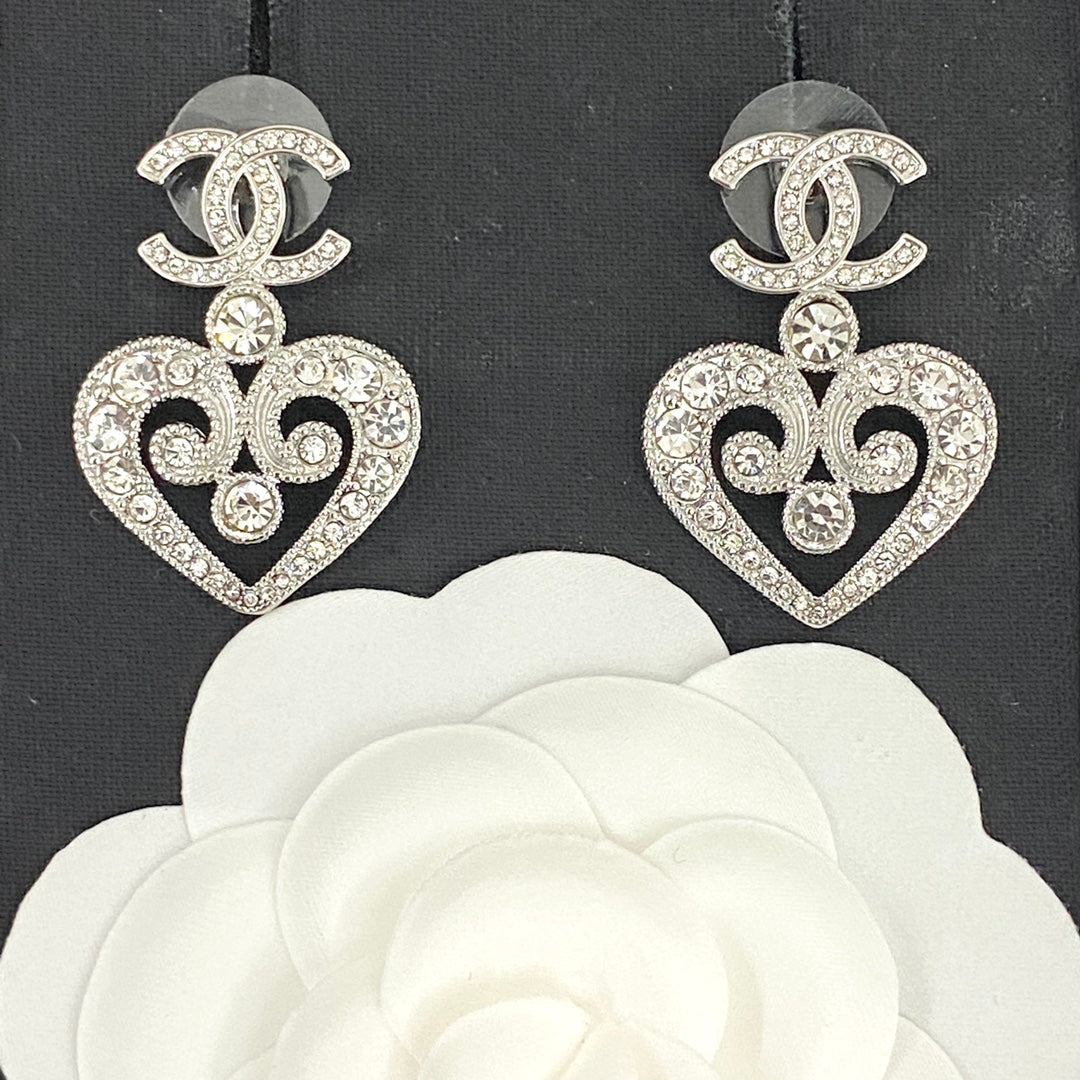 hollow crystal heart shaped double c silver earrings eha536