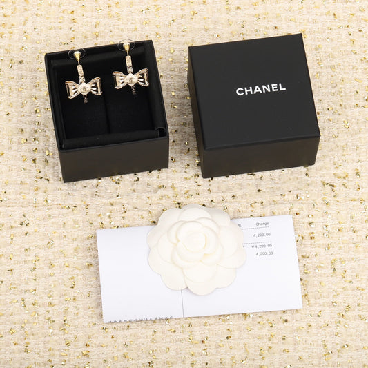 cha bow double c yellow gold earrings eha634