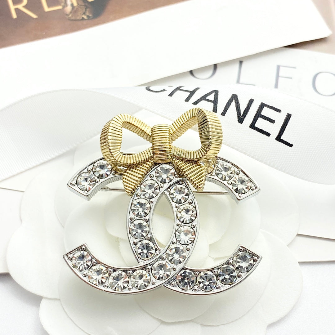 Gold and silver color blocked three-dimensional bow brooch XZA47