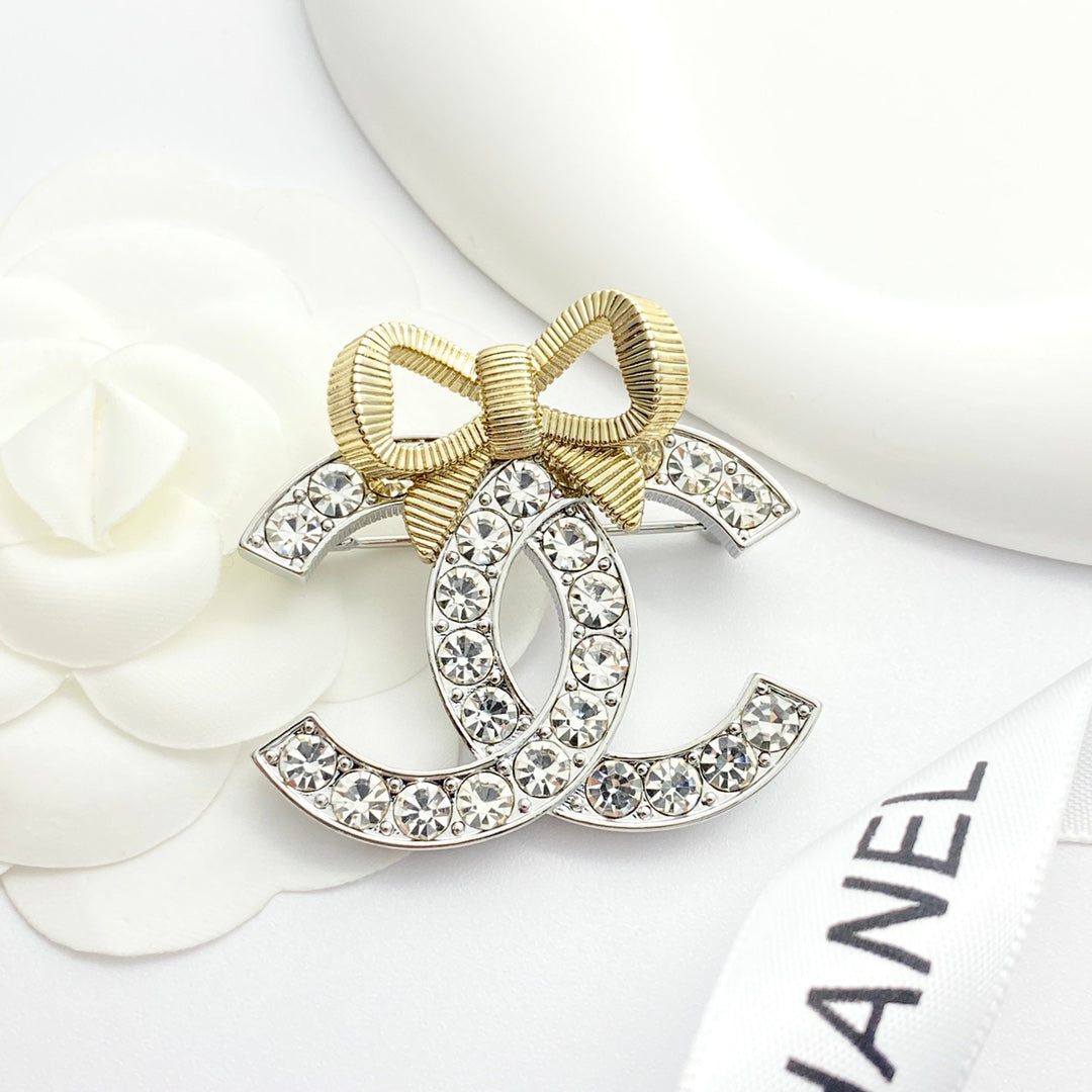 Gold and silver color blocked three-dimensional bow brooch XZA47