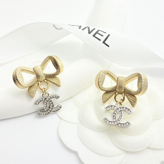 Gold and silver color blocked three-dimensional bow earrings EHA695