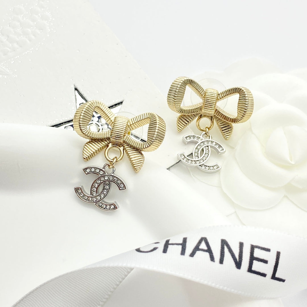 Gold and silver color blocked three-dimensional bow earrings EHA695