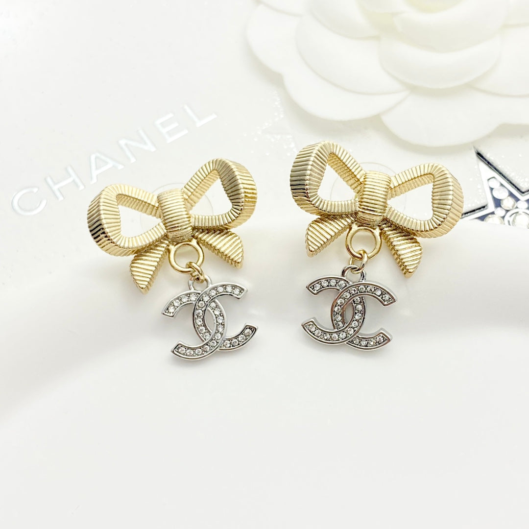 Gold and silver color blocked three-dimensional bow earrings EHA695