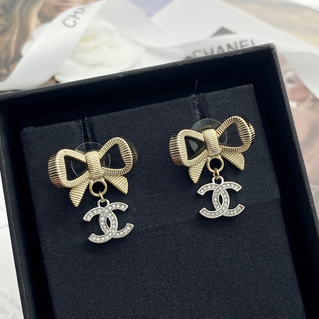 Gold and silver color blocked three-dimensional bow earrings EHA695