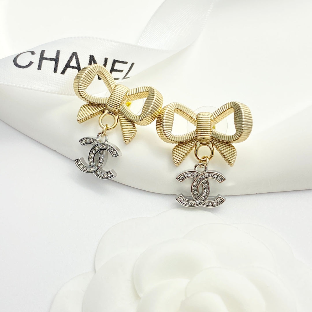 Gold and silver color blocked three-dimensional bow earrings EHA695