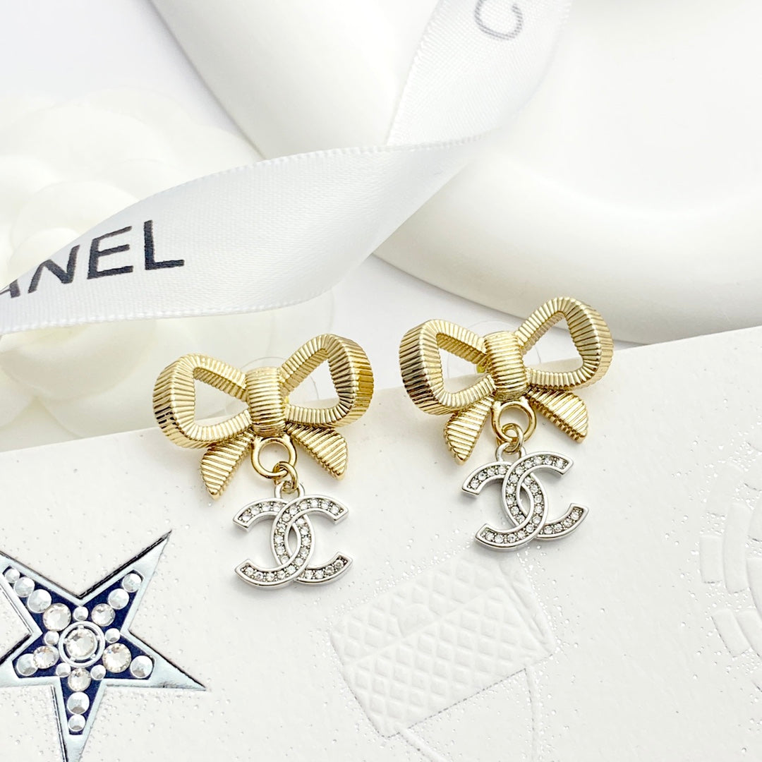 Gold and silver color blocked three-dimensional bow earrings EHA695