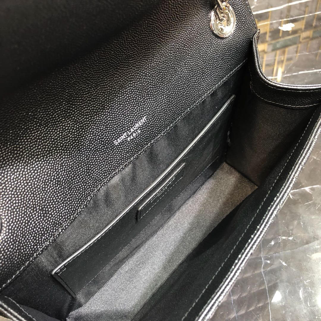 silver logo on the leather inside bag