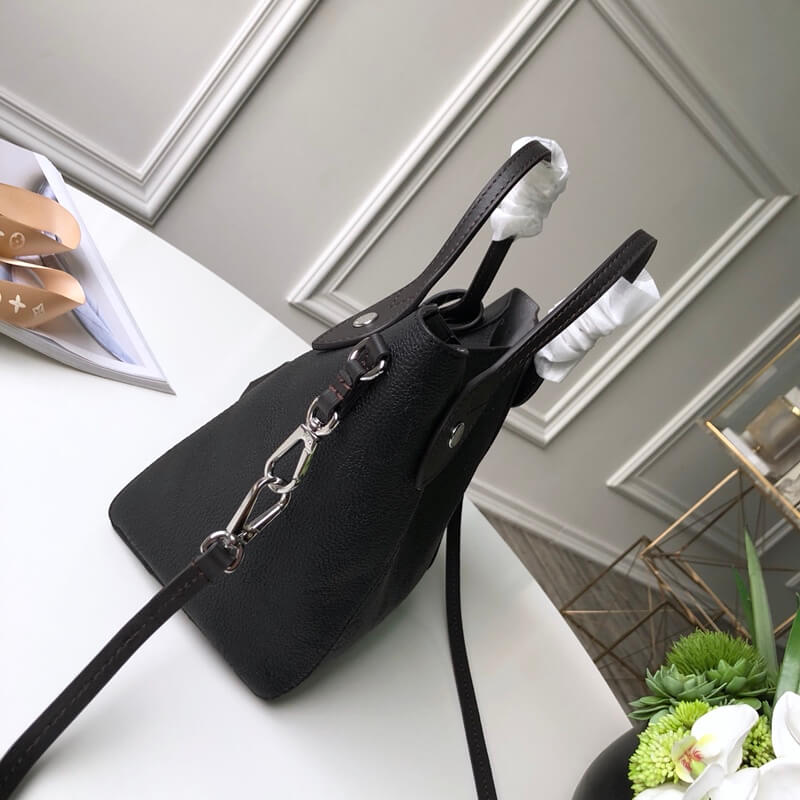 silver bucket strap black cow hide handbag