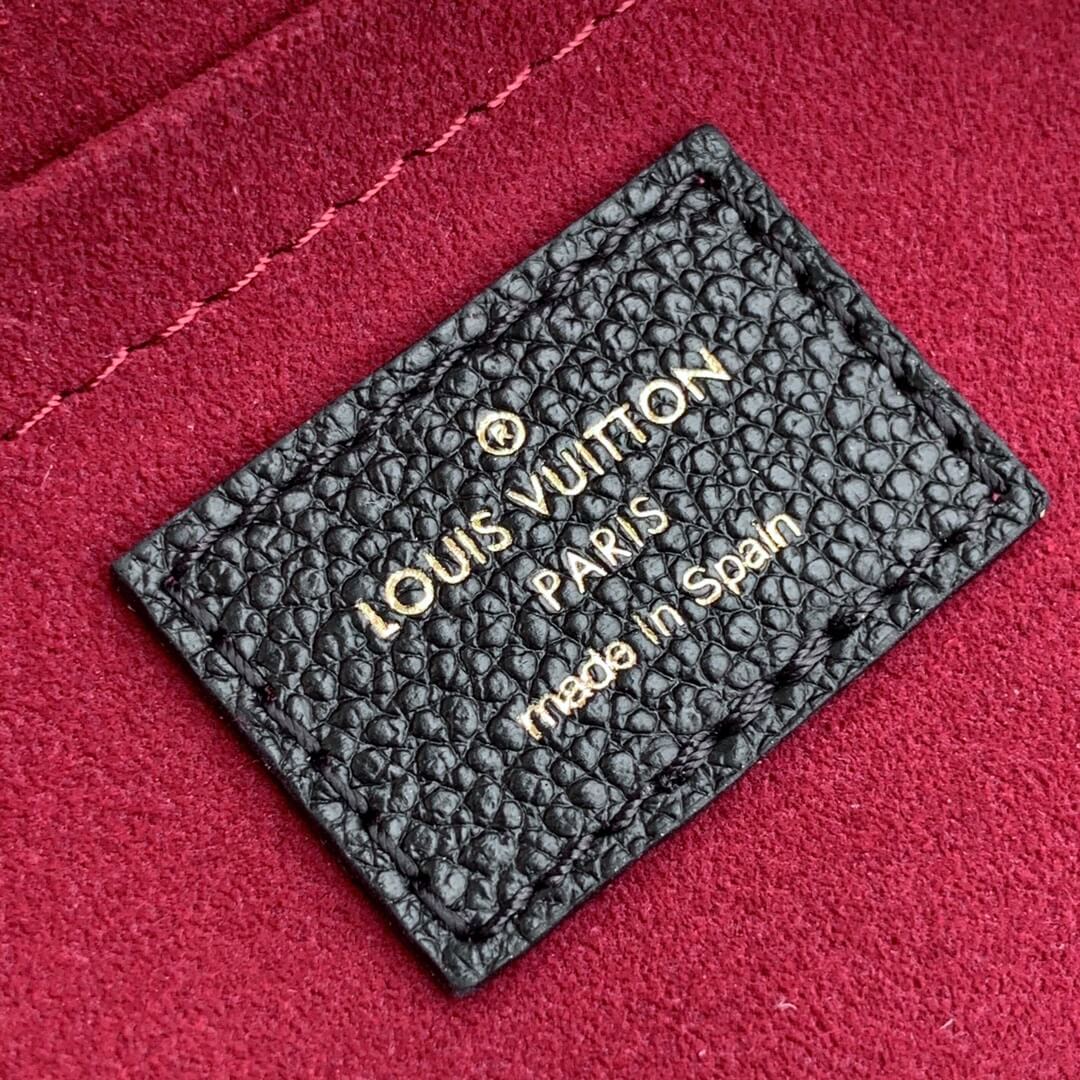 gold letter on the black leather tag red canvas inside