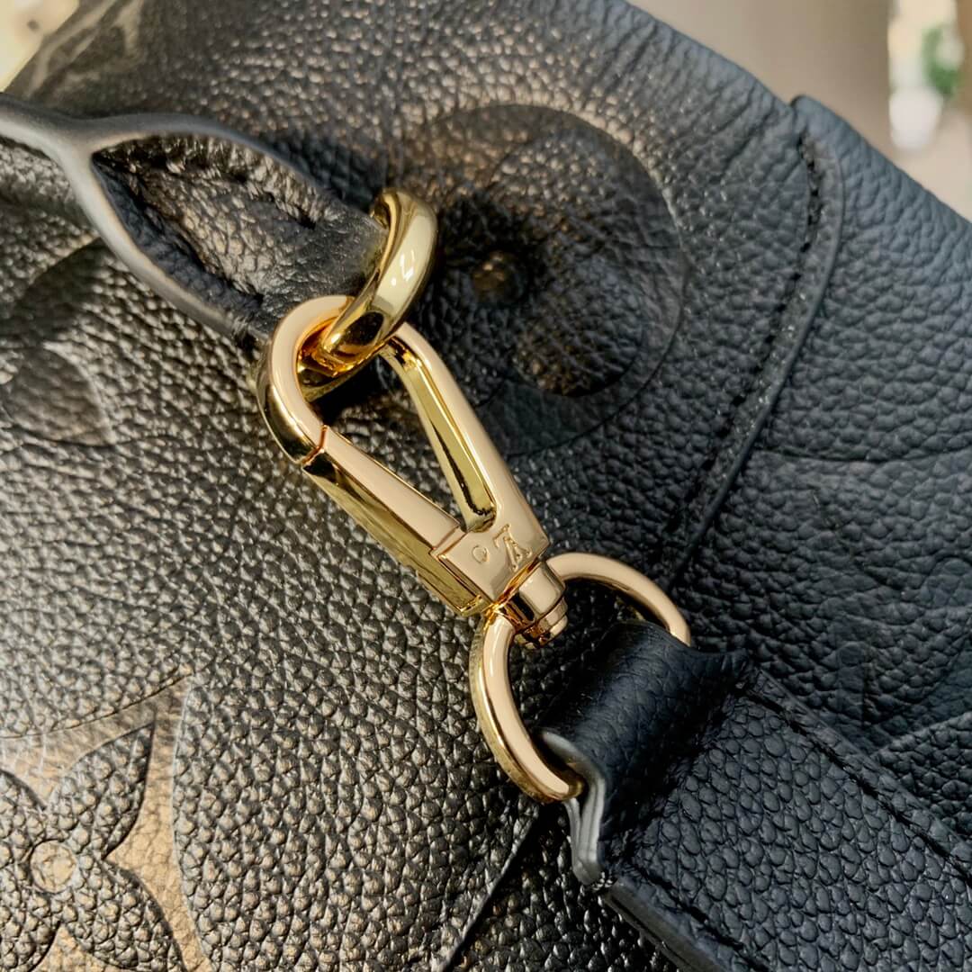 gold button on strap lv